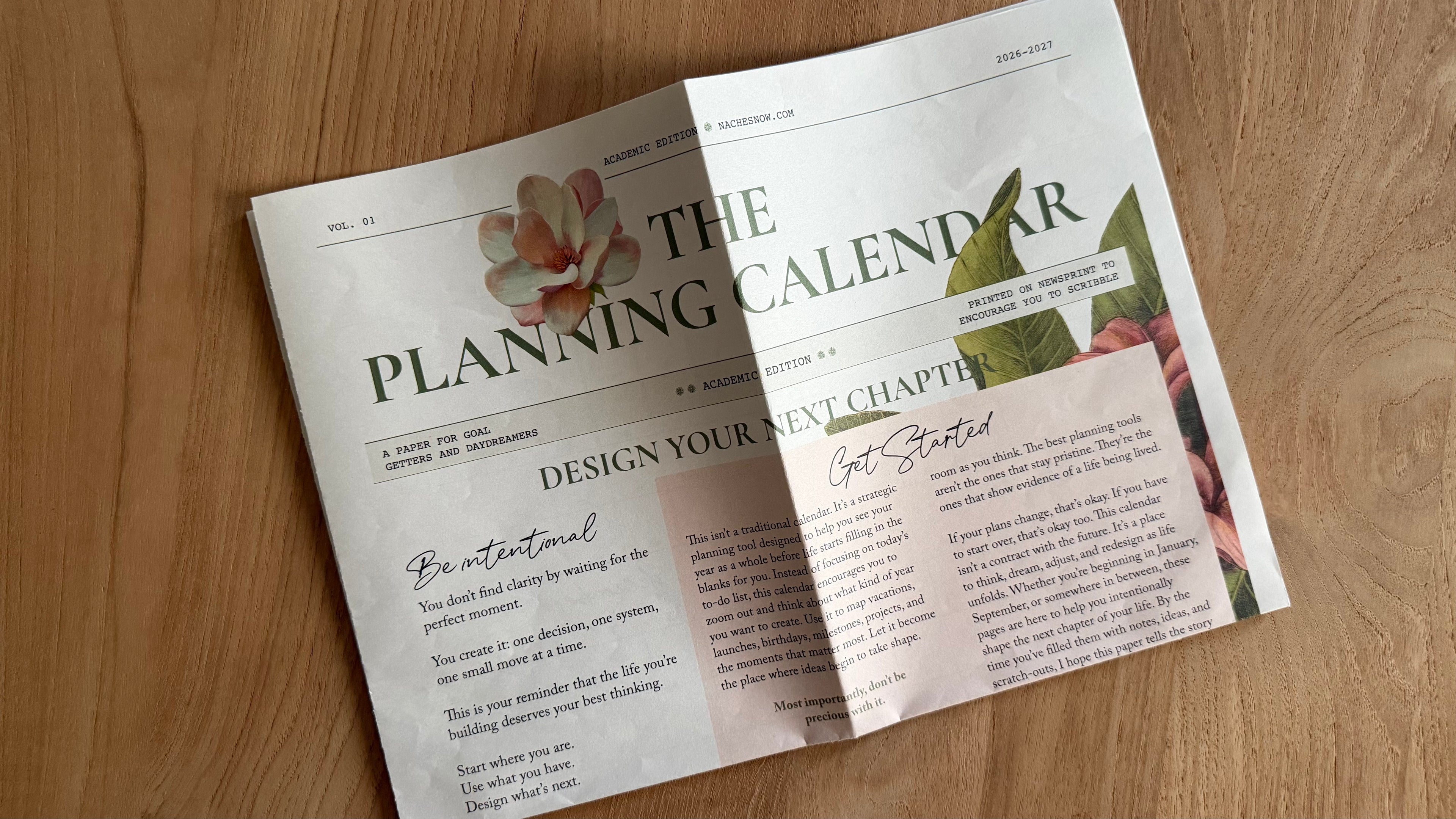 Front cover of The Planning Calendar reading Design Your Next Chapter, with magnolia artwork and the Be Intentional and Get Started essays.